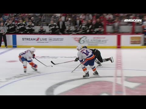 Mathew Barzal scores a goal against the New Jersey Devils