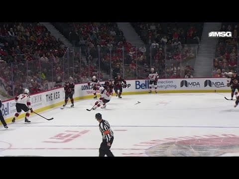 Shane Pinto scores a goal against the New Jersey Devils