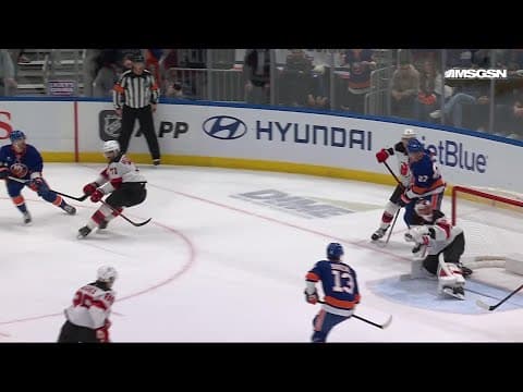 Adam Pelech scores a goal against the New Jersey Devils