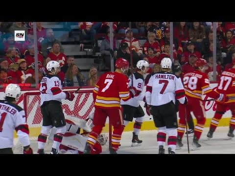 Dawson Mercer scores a goal against the Calgary Flames