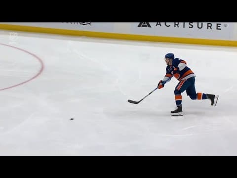 Luke Hughes scores a goal against the New York Islanders
